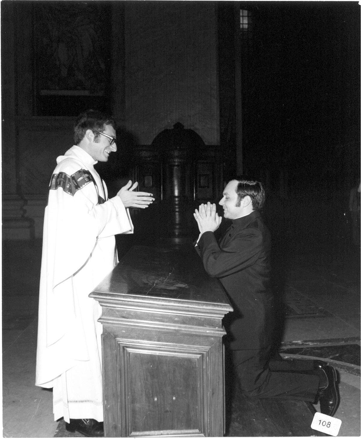 Father Evans blesses his longtime friend, then-Deacon Raymond Bastia, at then-Father Evans’ priestly ordination in 1973. The two priests grew up together on Federal Hill and maintain a friendship that continues today.